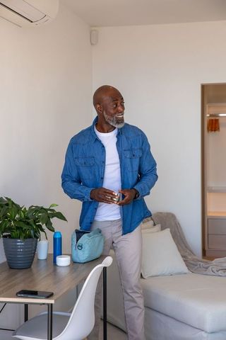 Senior african american man enjoying wellness at home
