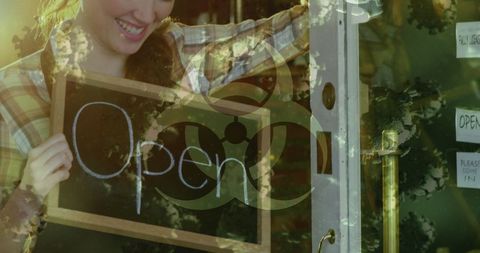 Entrepreneurial Woman Holding Open Sign at Smiling Welcome - Download Free Stock Images Pikwizard.com