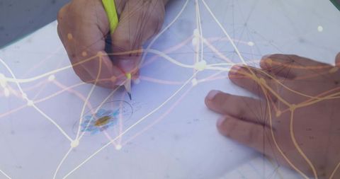Engineer Sketching Technical Diagram with Digital Network Overlay