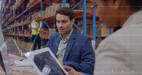 Warehouse Team Analyzing Inventory Data on Tablet and Laptop with Analytics Overlay