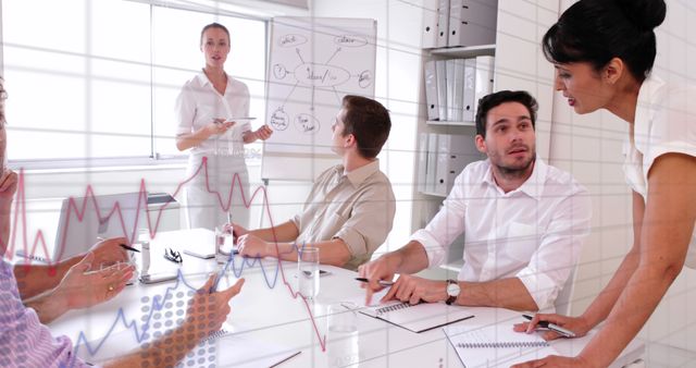 Team Discussing Strategy in Modern Office with Graph Overlay - Download Free Stock Images Pikwizard.com