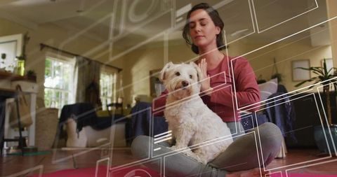 Woman Practicing Yoga with Dog Relaxing in Cozy Living Room