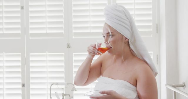 Woman Drinking Tea After Shower in Bright Bathroom - Download Free Stock Images Pikwizard.com