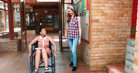 Friends Connecting in School Hallway with Disability Awareness - Download Free Stock Images Pikwizard.com