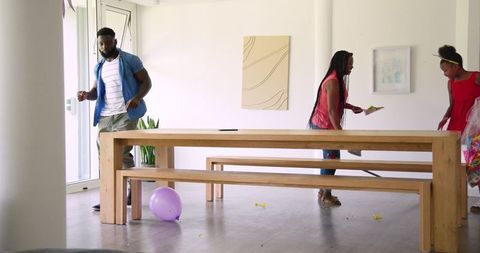 African American Family Preparing for Celebration at Home