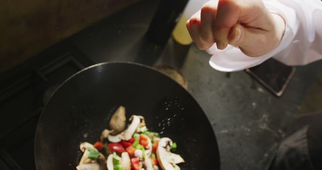 Chef seasoning fresh vegetables in skillet - Download Free Stock Images Pikwizard.com