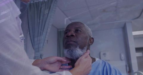 Medical professional examining senior patient’s neck in hospital setting