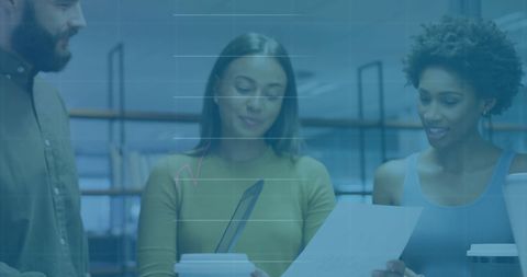 Diverse Team Collaborating on Financial Report with Technology