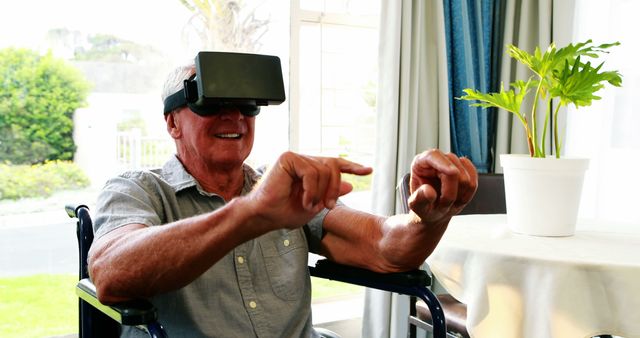 Senior Man Using Virtual Reality in Wheelchair at Home - Download Free Stock Images Pikwizard.com