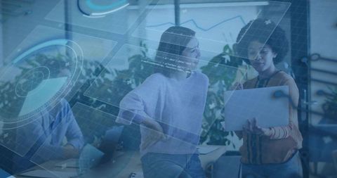 Colleagues collaborating over tablet with holographic data overlays and analytics ui