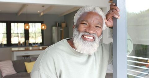 Elderly Man Relaxing in Modern Home Reflecting Inner Peace