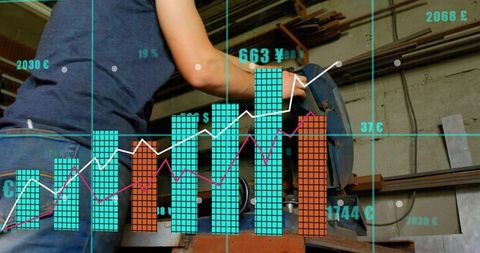 Worker operating mounted cutoff saw in workshop with financial data overlay and charts
