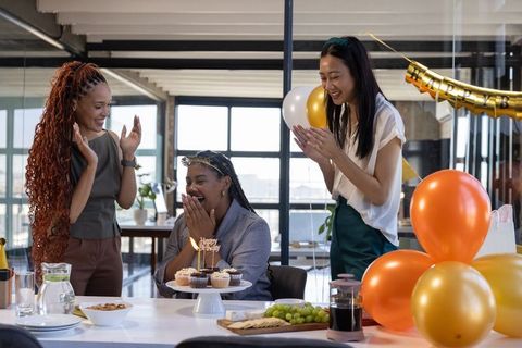 Diverse Coworkers Celebrating Birthday in Modern Office Setting