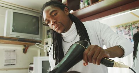 Talented Hairdresser Styling Hair in Local Salon