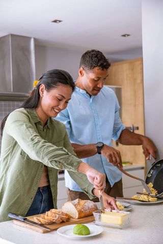 Diverse Couple Enjoying Cooking Breakfast Together