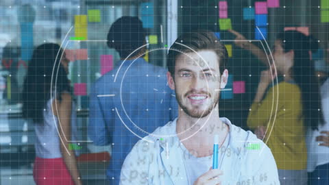 Diverse Professionals Engaging with Digital Interface In Office