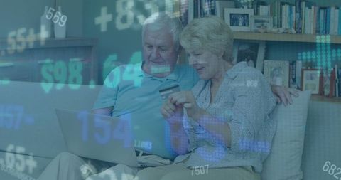 Senior Couple Shopping Online with Digital Financial Overlay