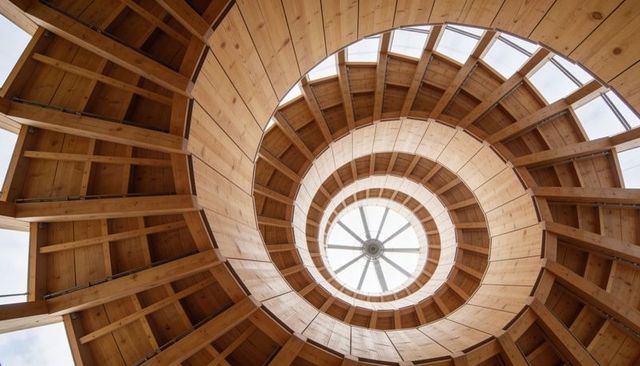 Spiral Wooden Tower Interior Showing Concentric Timber Rings, Radial Beams and Skylight