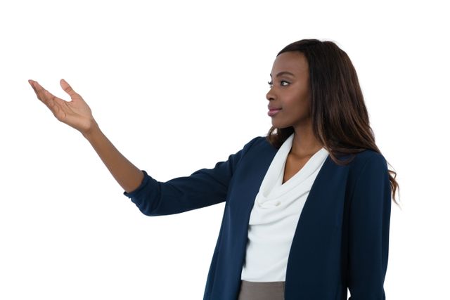 Businesswoman gesturing while giving presentation against white background