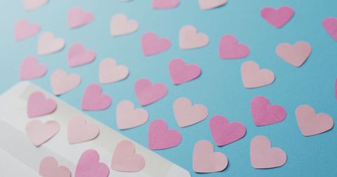 Paper Hearts Scattered From Envelope on Blue Background - Download Free Stock Images Pikwizard.com
