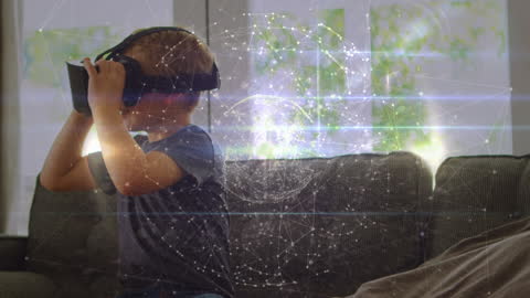 Young Boy Immersed in Virtual Reality Experience