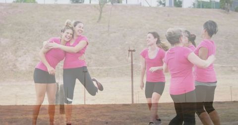 Group of cheerful women celebrating outdoors in upbeat mood