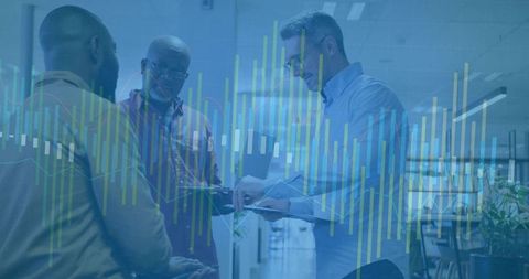 Business Professionals Collaborating with Digital Analytics in Modern Office