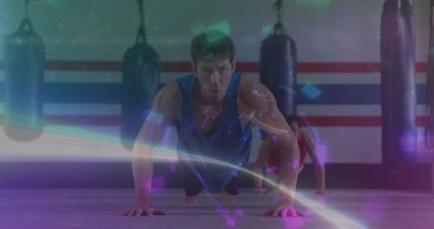 Intense Fitness Training: Man Doing Push-ups in Boxing Gym