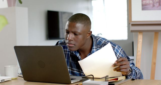 Focused Young Man Working on Laptop at Home Office - Download Free Stock Images Pikwizard.com