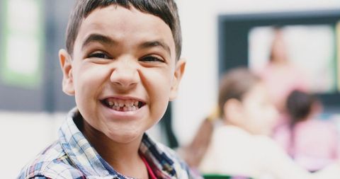 Joyful Child with Big Smile, Happy Moment in Classroom