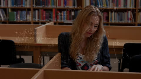 Student Solving Advanced Mathematical Equations in Library