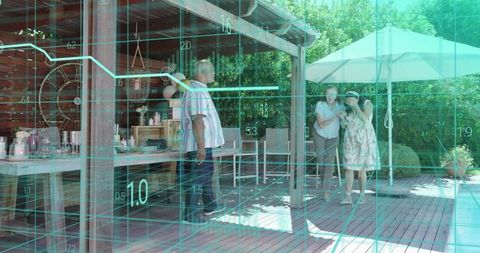 Friends enjoying backyard gathering on pergola deck by pool with teal digital data overlay