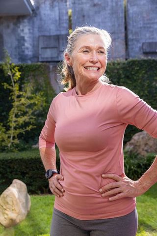 Active Senior Woman Enjoying Outdoor Fitness in Garden