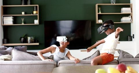 Excited Children Discover Virtual Reality in Modern Living Room
