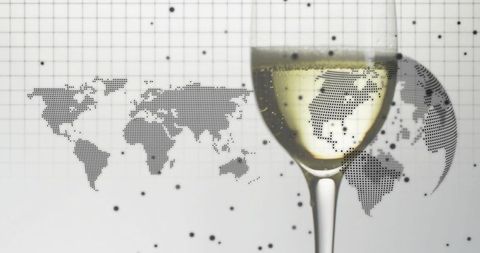 Wine glass refracting dotted world map for global cartography and travel concept