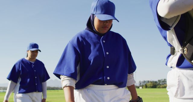 Teen Baseball Players in Blue Uniforms Gearing Up for Practice - Download Free Stock Images Pikwizard.com