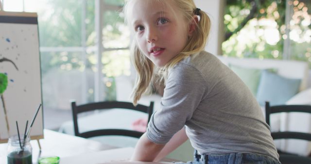 Young Girl Painting with Enthusiasm in Cozy Living Room - Download Free Stock Images Pikwizard.com