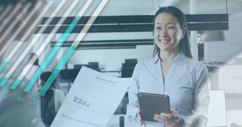 Korean Businesswoman Presenting Tablet and Quarterly Report in Modern Office with Teal Overlay