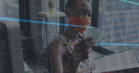 Masked Businesswoman Analyzing Financial Data in Office Environment