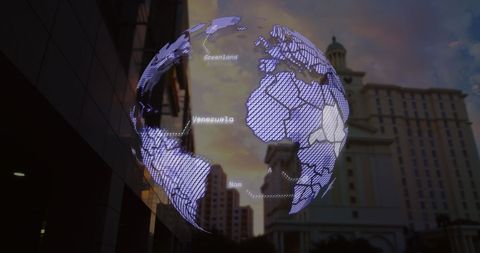 Digital Globe Overlay Displaying Data on Urban Cityscape