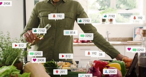 Influencer Cooking Prep in Modern Kitchen with Social Media Engagement