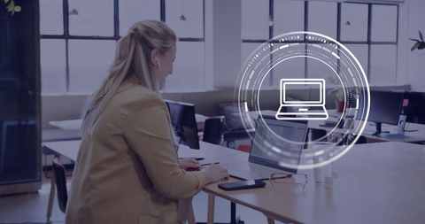 Caucasian Businesswoman Using Laptop with Digital Interface Overlay