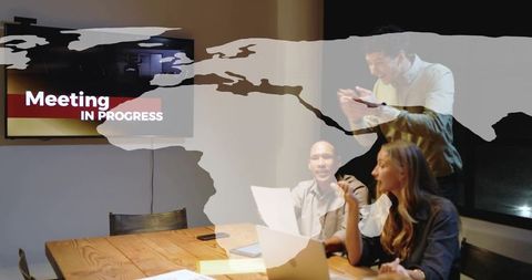 Global team collaborating in boardroom with meeting in progress screen overlay