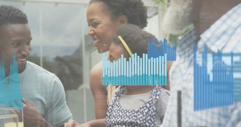 Multigenerational family gathering sharing juice and laughter with blue analytics overlay at home