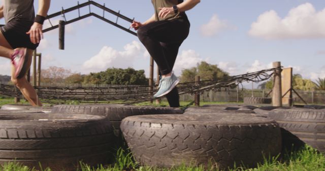 Athletic People Running on Tire Course Outdoors - Download Free Stock Images Pikwizard.com