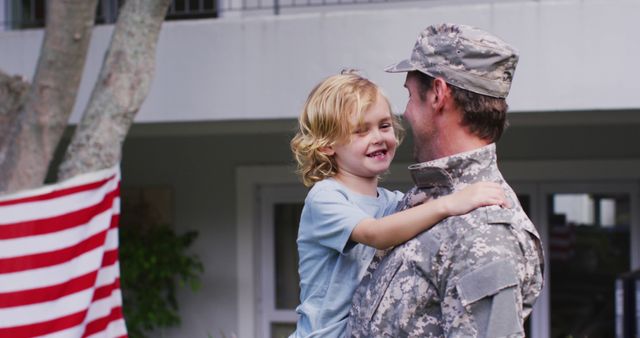 Caucasian military dad in uniform picking up his son in the garden - Download Free Stock Photos Pikwizard.com