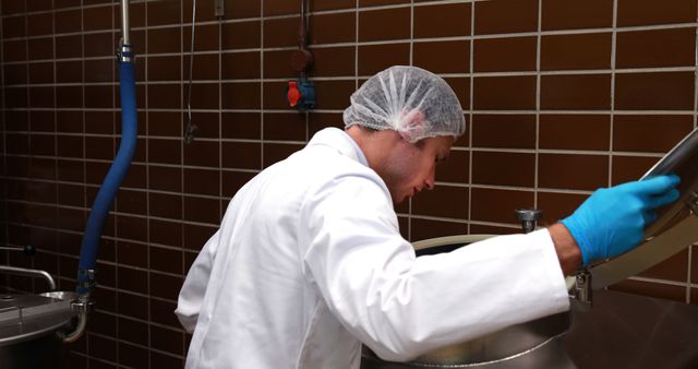 Chef Inspecting Equipment in Hygienic Commercial Kitchen - Download Free Stock Images Pikwizard.com