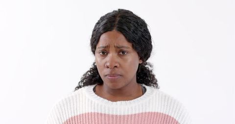 Thoughtful african american woman with concerned expression