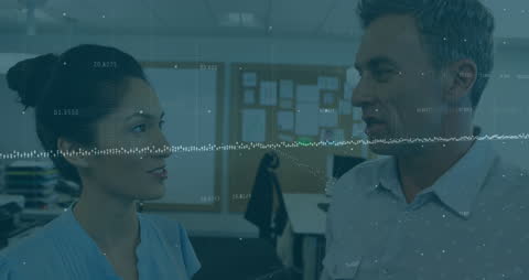 Colleagues Discussing Economic Trends with Stock Market Visuals