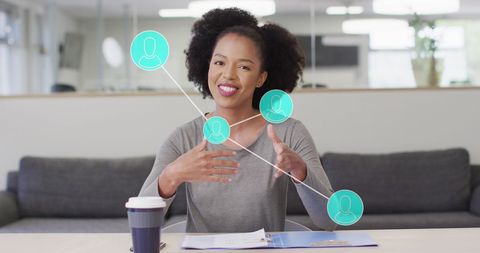 Businesswoman engaging with virtual network graphics